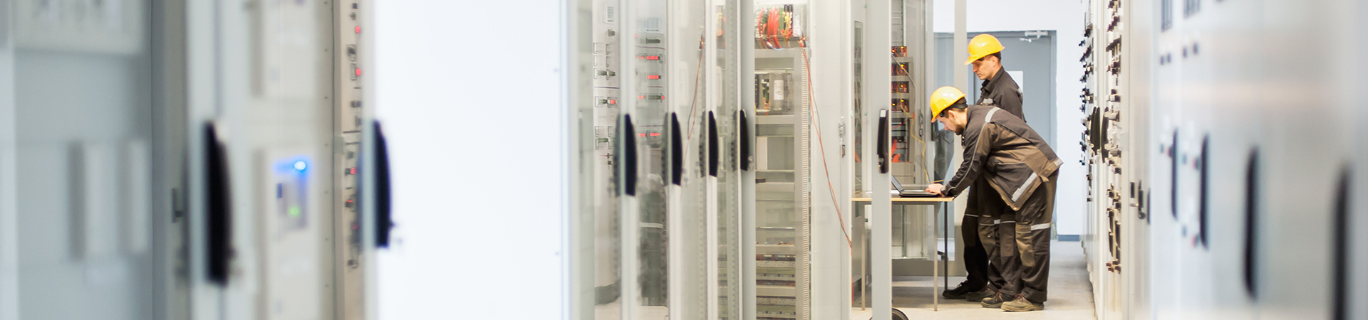 Field service crew testing electronics or inspecting electrical installation system.